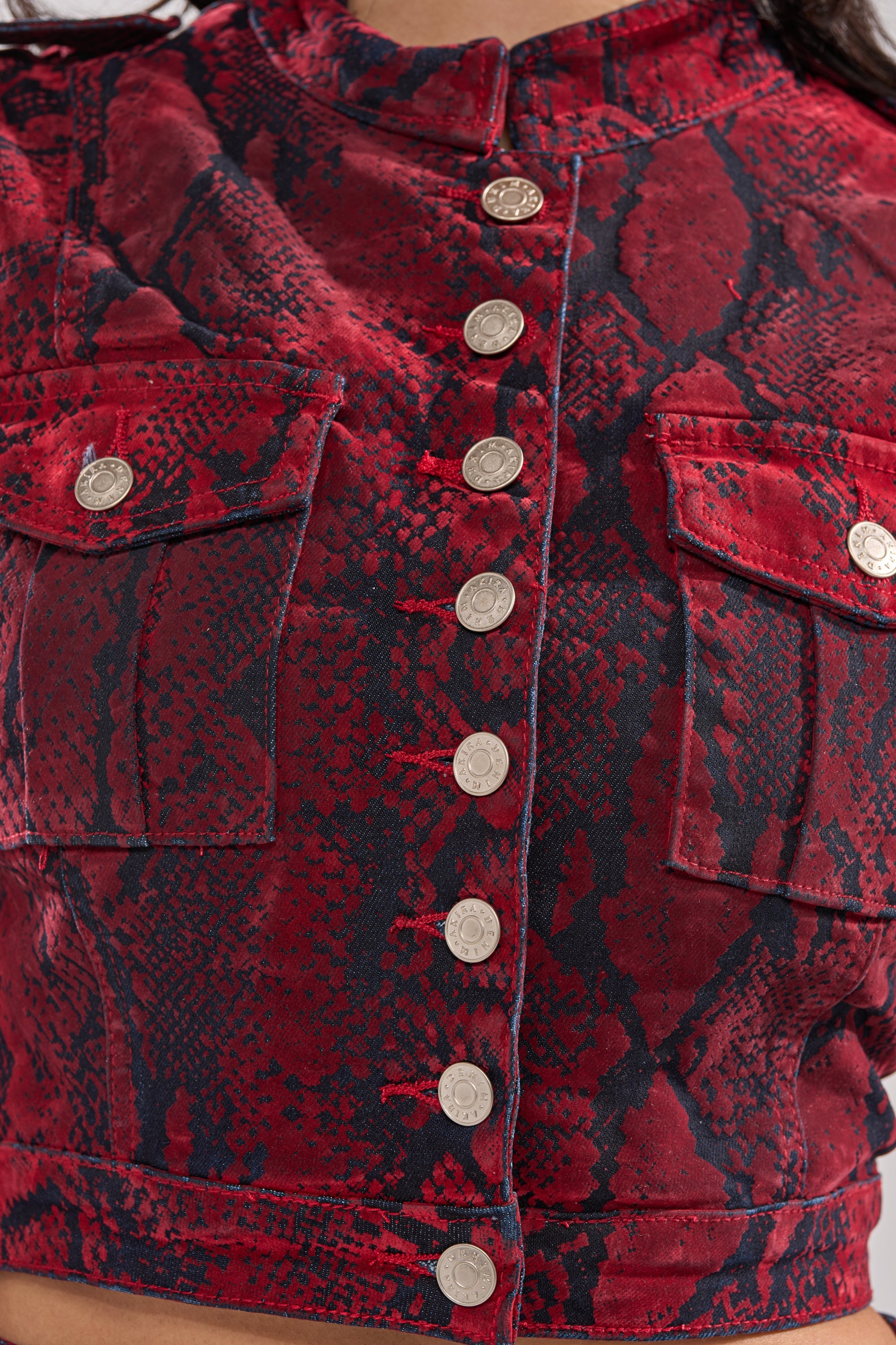 FLOATING IN BETWEEN SNAKE BUTTON DOWN