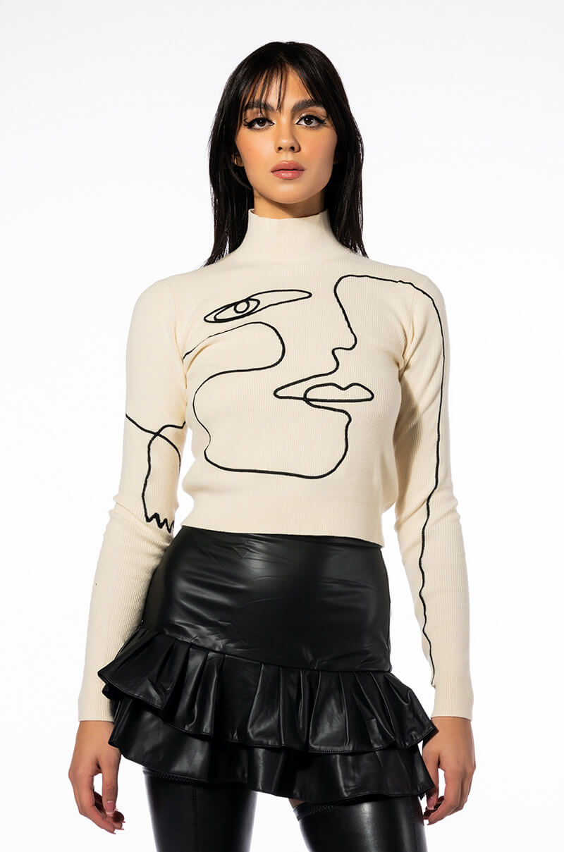 WILLA ABSTRACT FACE RIBBED TURTLENECK SWEATER