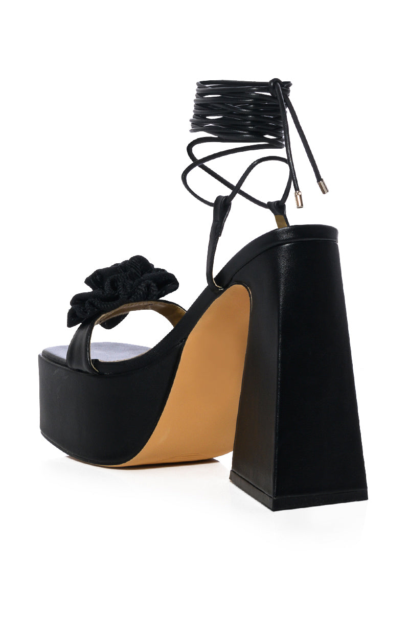 SOMETHING SWEET CHUNKY PLATFORM LACE UP SANDAL WITH FLOWER DETAIL IN BLACK